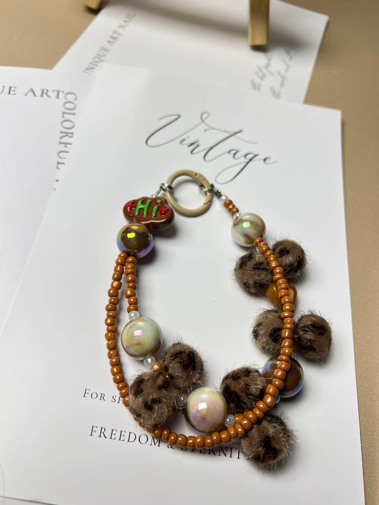 Leopard Print Pompom Phone Charm | Knotive