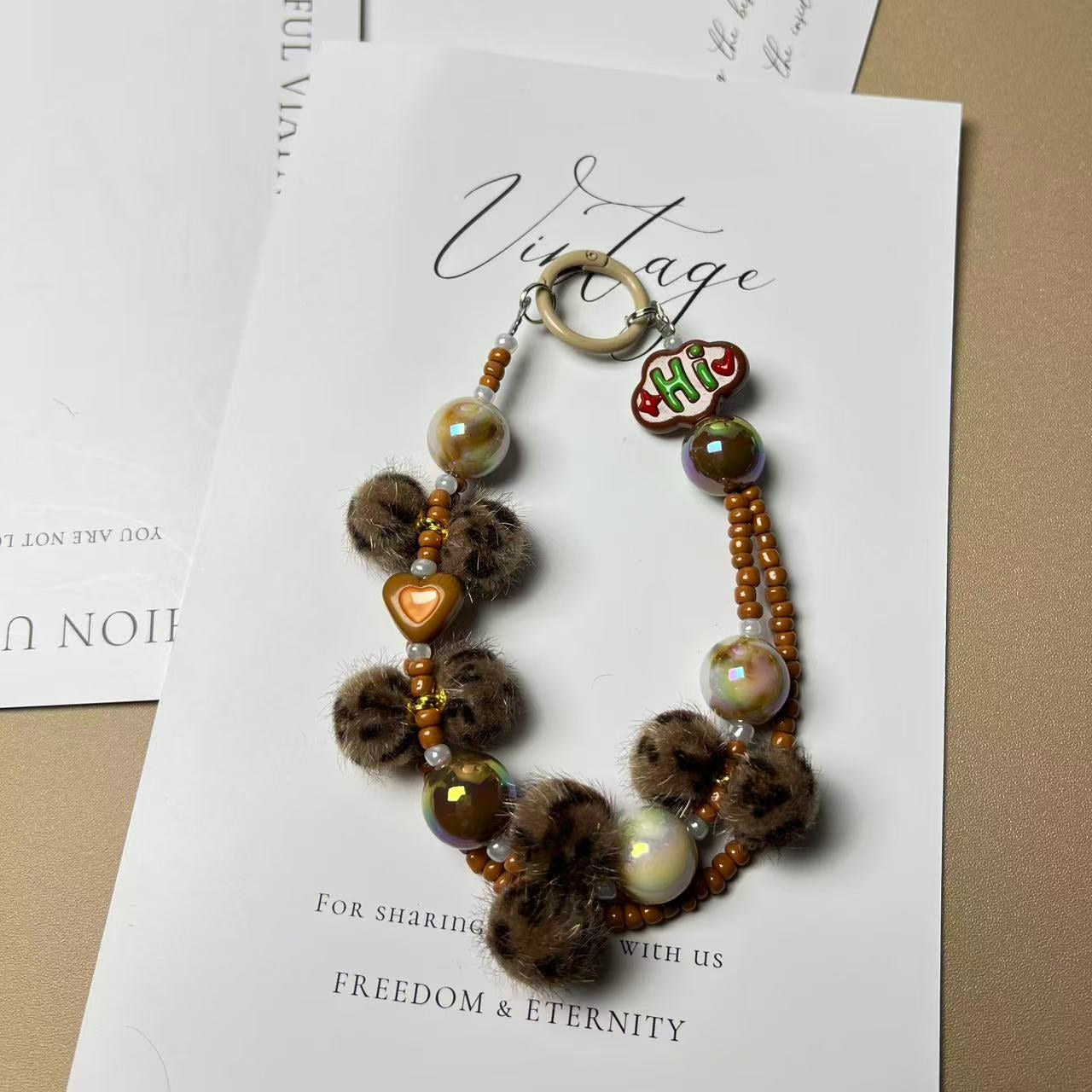 Leopard Print Pompom Phone Charm | Knotive